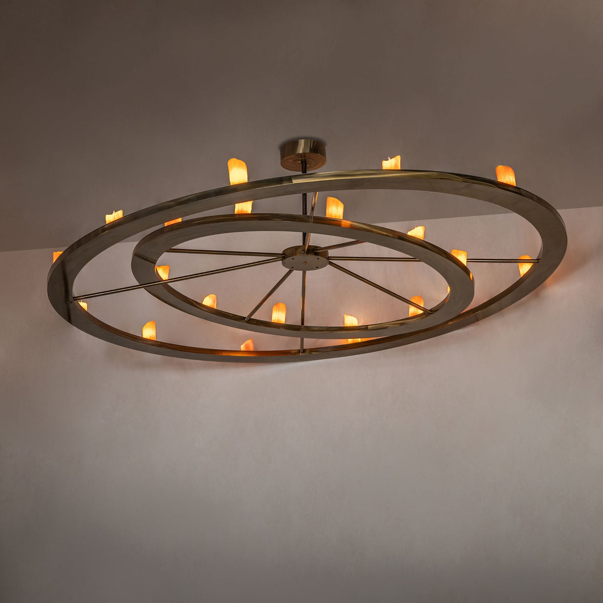 Donner 24 light chandelier installed in modern interior with warm ambient glow.