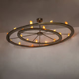 Donner 24 light chandelier installed in modern interior with warm ambient glow.