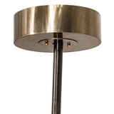 Close-up of Donner chandelier ceiling canopy and suspension rod in brass finish.