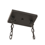 Closeup of ceiling canopy and dual chain suspension of Elana chandelier.