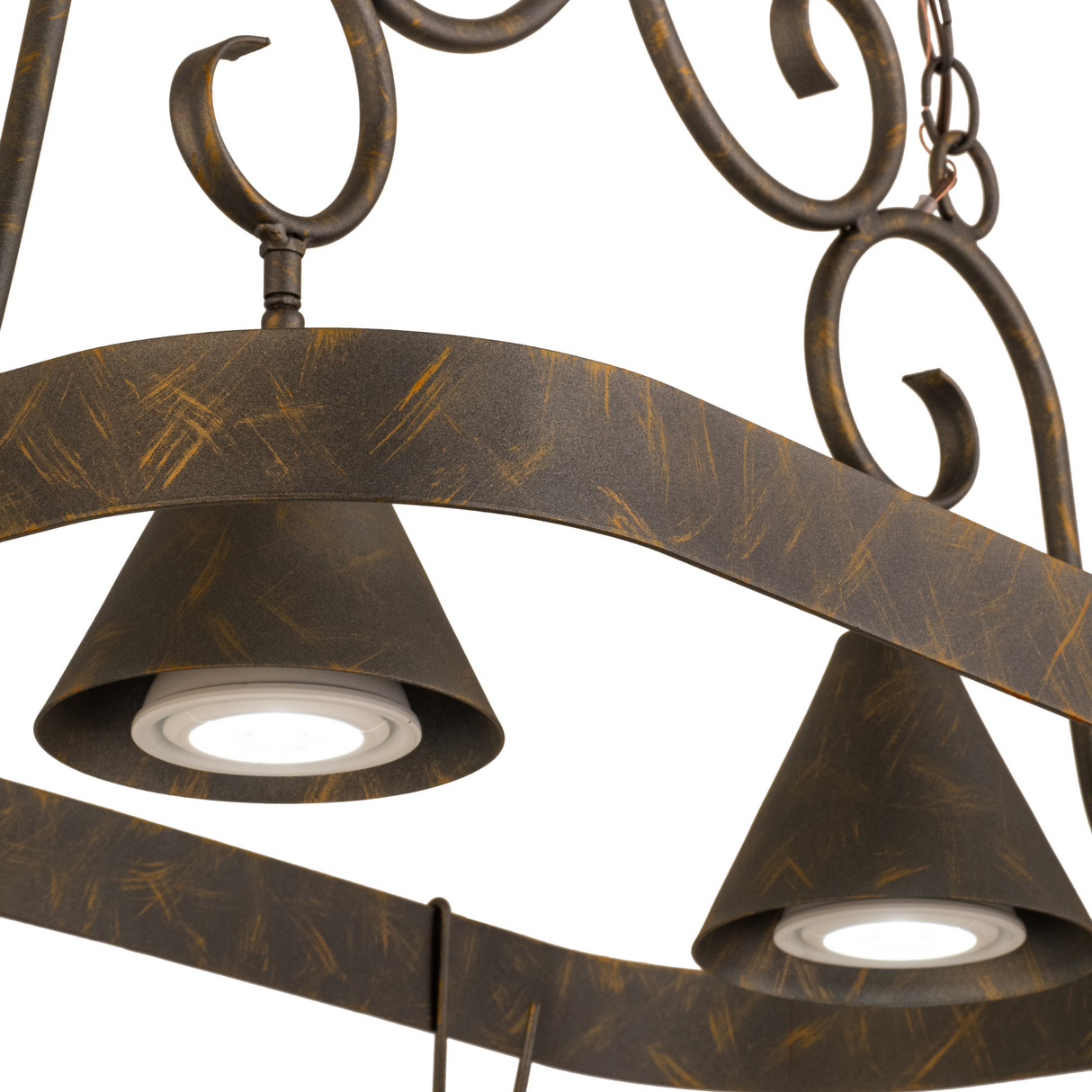 Close-up of lit Elana chandelier lights and detailed scroll accents.