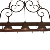 Detailed view of hand-forged scrollwork design on pot rack.