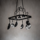 Black iron Elana 3 light pot rack lit in kitchen setting.