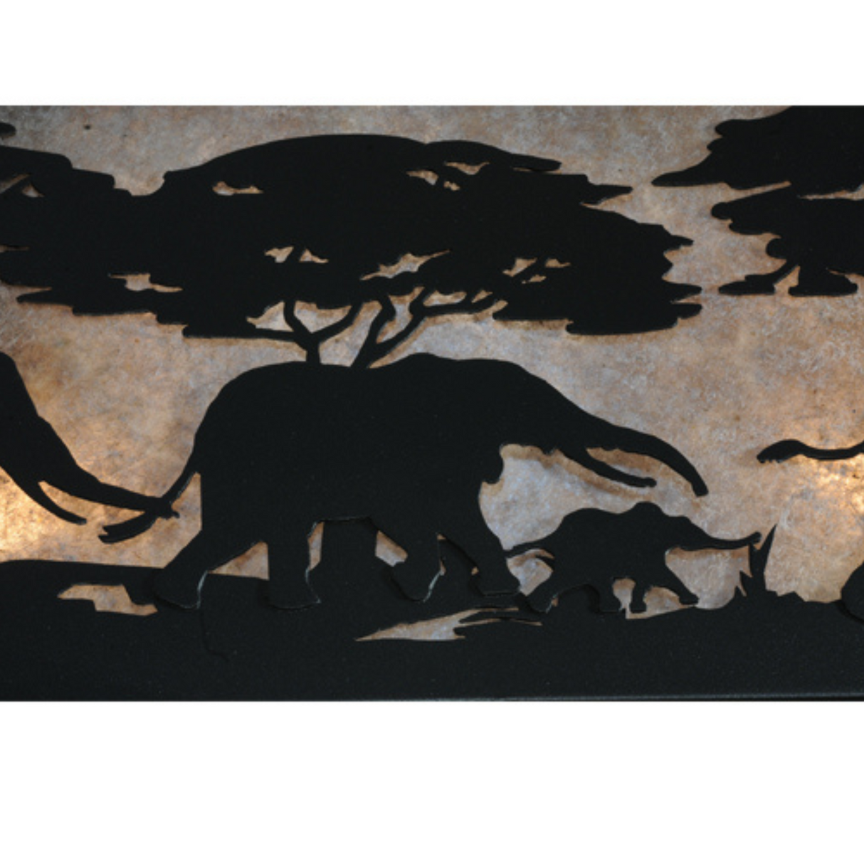Close-up of elephant and tree cutout detail on silver mica panel.