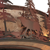 Closeup of elk figure and handcrafted pine cutouts in metal frame.