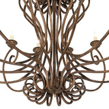 Closeup of Fernando chandelier iron scrollwork and faux candlelight bobeches.