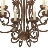 Detailed view of curled arm and candle socket on Fernando chandelier.