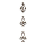Fernando three-tier chandelier unlit, antiquity finish scrollwork fixture.