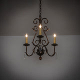 French Elegance 3-light chandelier lit in a dark room setting showing warm ambient glow.