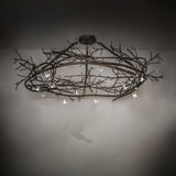 Gardner branch chandelier shown in ambient interior lighting setting.