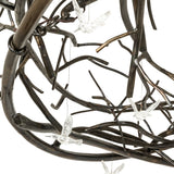 Close-up of twisted metal branches on Gardner chandelier.