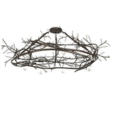 Unlit branch-style chandelier with dark burnished antique copper finish.