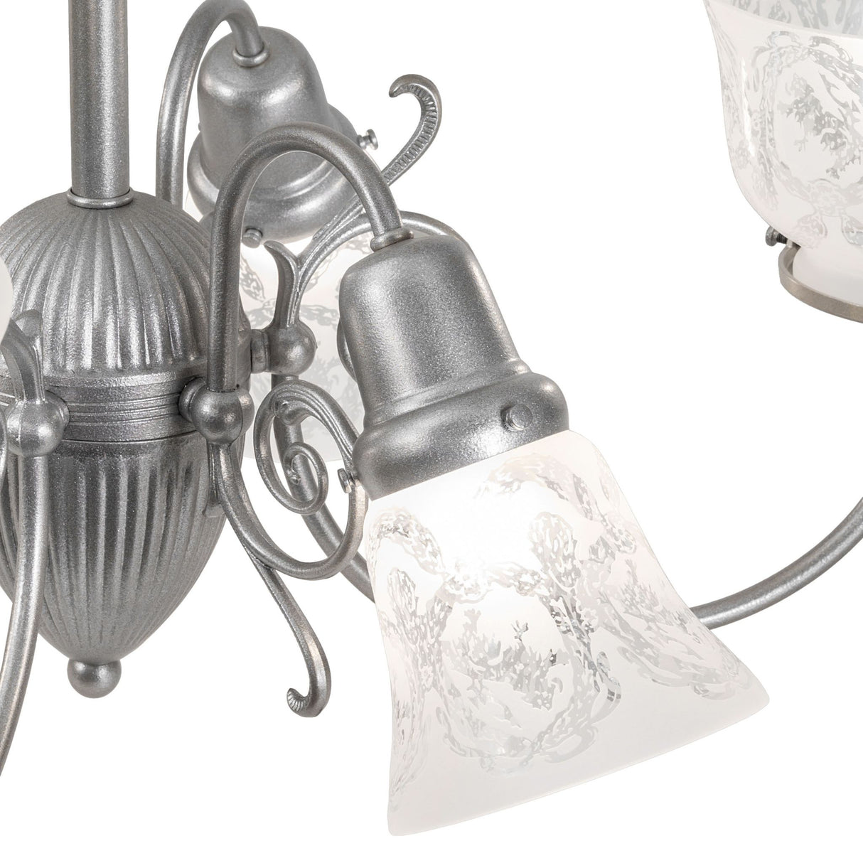Detailed view of metal fittings and arm connections on gas and electric 6 light chandelier.