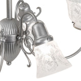 Detailed view of metal fittings and arm connections on gas and electric 6 light chandelier.