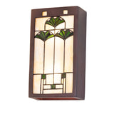 Angled side view of Ginkgo wall sconce featuring green leaf glass details.