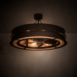 Illuminated Golden Forge Chandel-Air glowing warmly in a dim room with rustic metal frame.