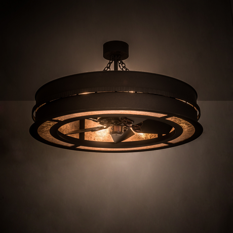 Illuminated Golden Forge Chandel-Air glowing warmly in a dim room with rustic metal frame.