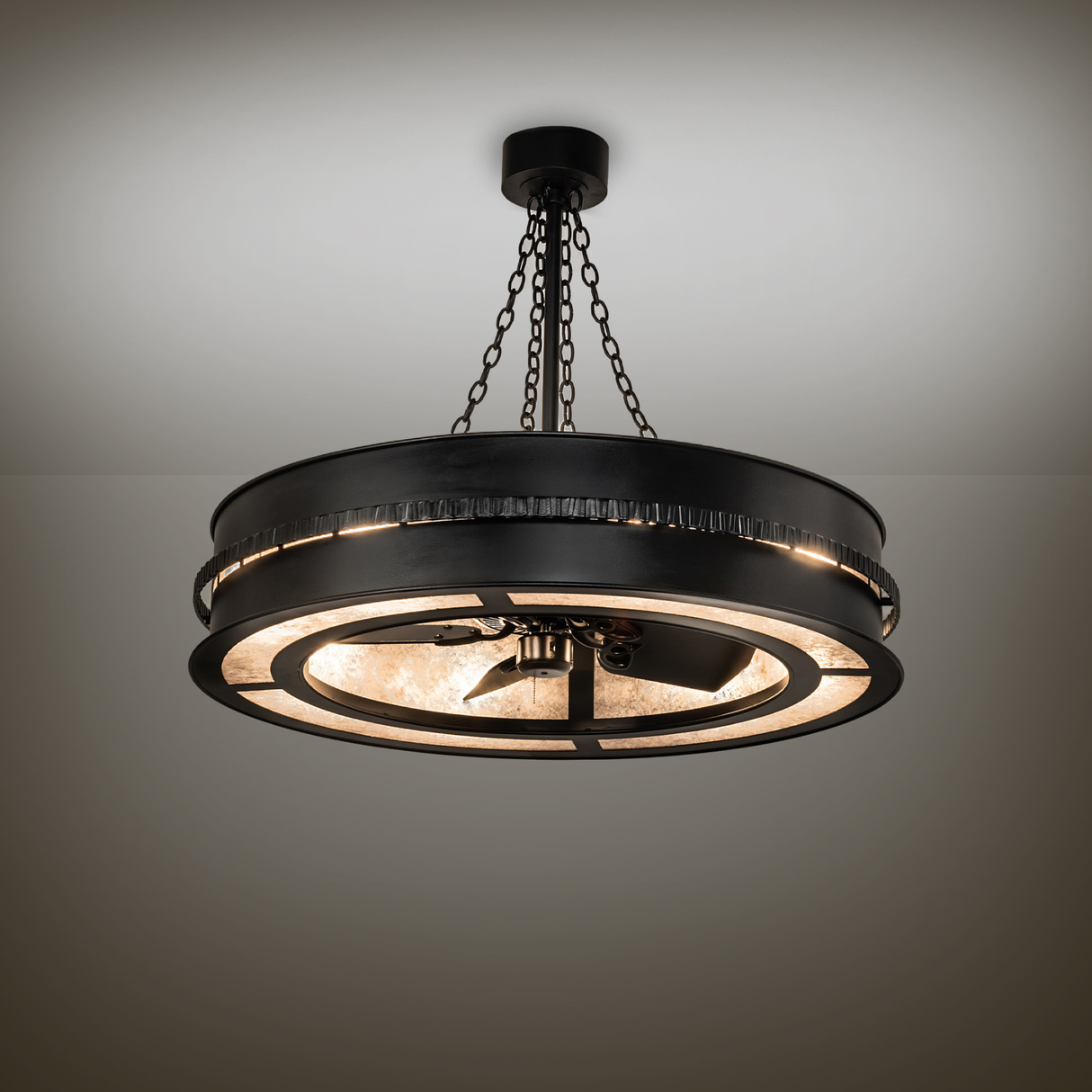 Chandelier fan softly lighting room with industrial black satin finish.