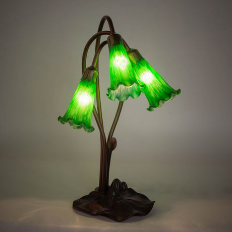 illuminated amber view of green pond lily accent lamp showcasing a warm emerald glow.