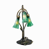 lit view of green pond lily accent lamp with vibrant glowing emerald green shades.