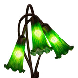 closeup view of emerald green hand-blown glass shades on green pond lily accent lamp.