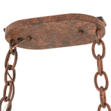 Close-up of ceiling canopy and chain hardware in rustic finish.