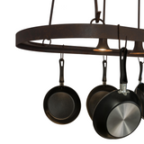 Close-up of forged iron frame and cookware hooks.