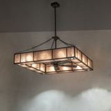 Large Hausman chandelier fan glowing warmly in a modern interior.