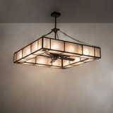 Hausman Chandel-Air illuminating wall with warm layered lighting.
