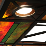 Downlight close-up showing stained glass panel illumination.