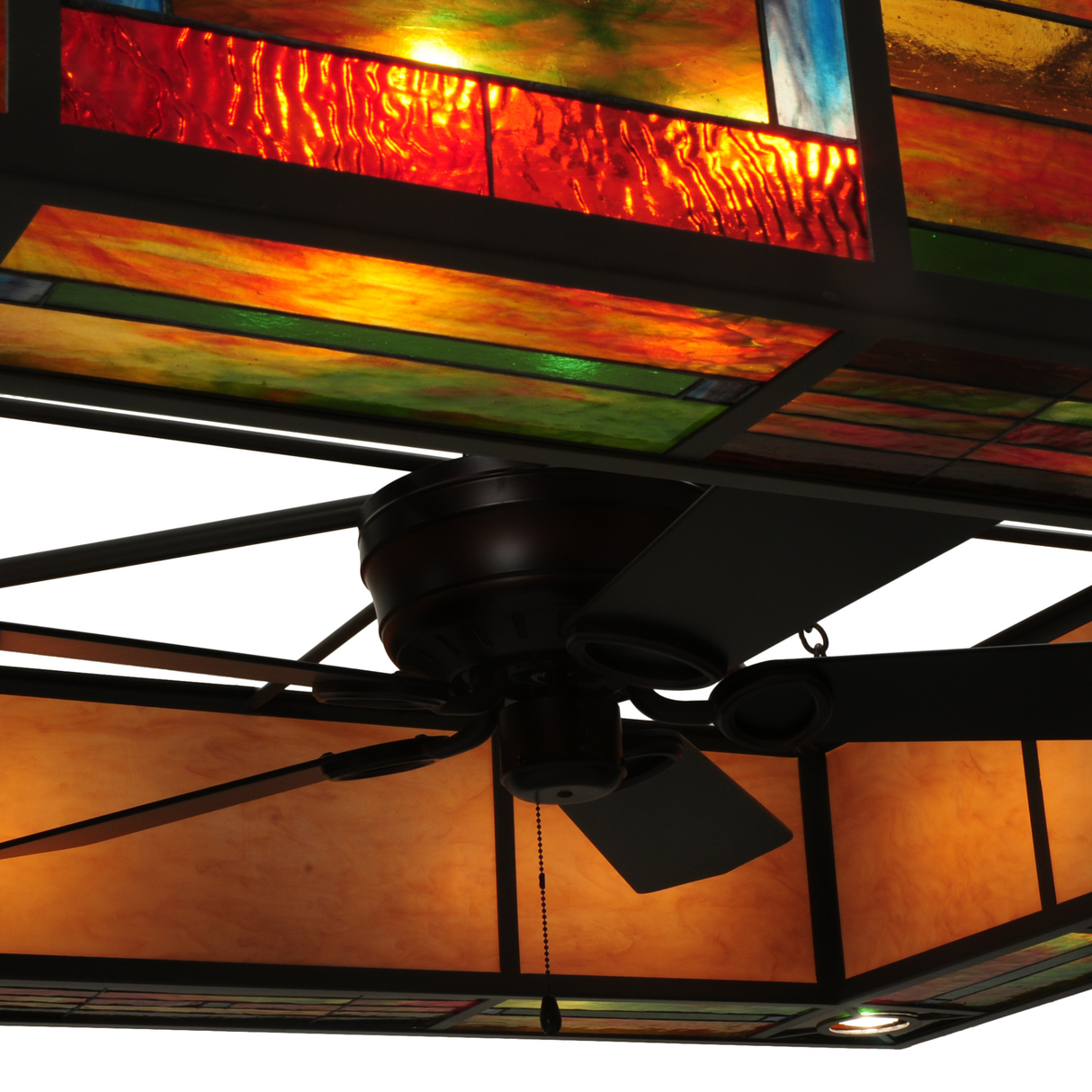 Inner fan and light integration beneath stained glass canopy.