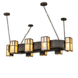 Lit view of chandelier featuring beige iridescent glass lanterns and oil rubbed bronze hardware.