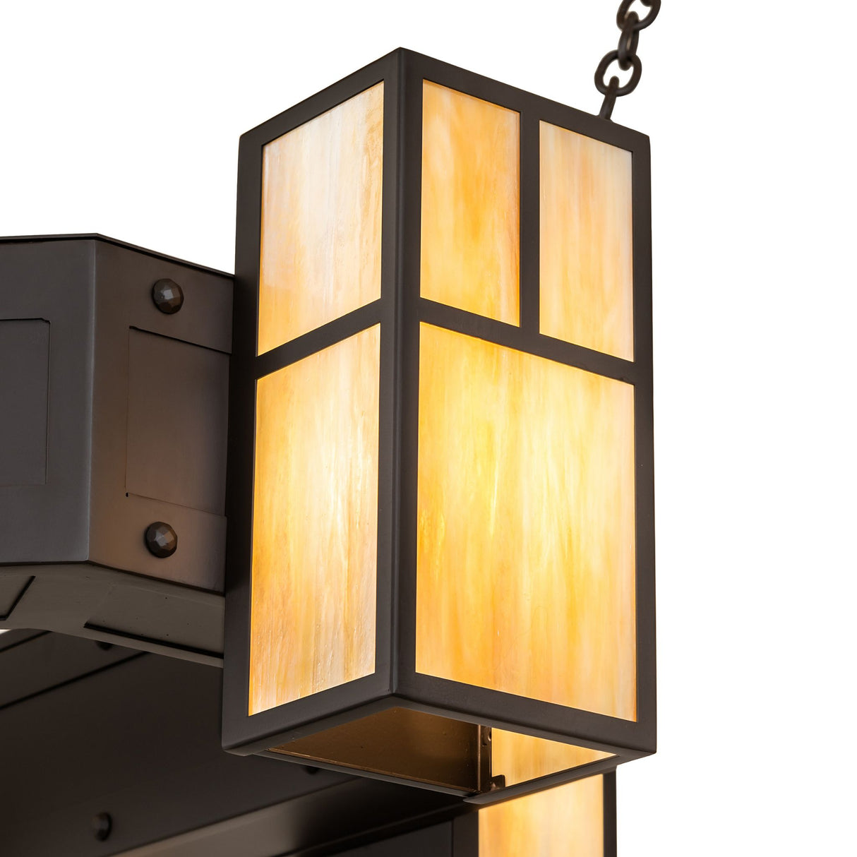 Bottom view of lantern highlighting illuminated base and beige iridescent glass.
