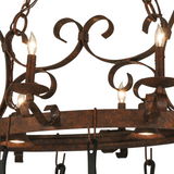 Close-up of iron scroll detail on pot rack chandelier.