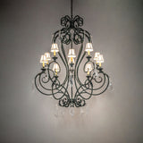 Josephine chandelier casting warm ambient light with fabric shades and crystals.