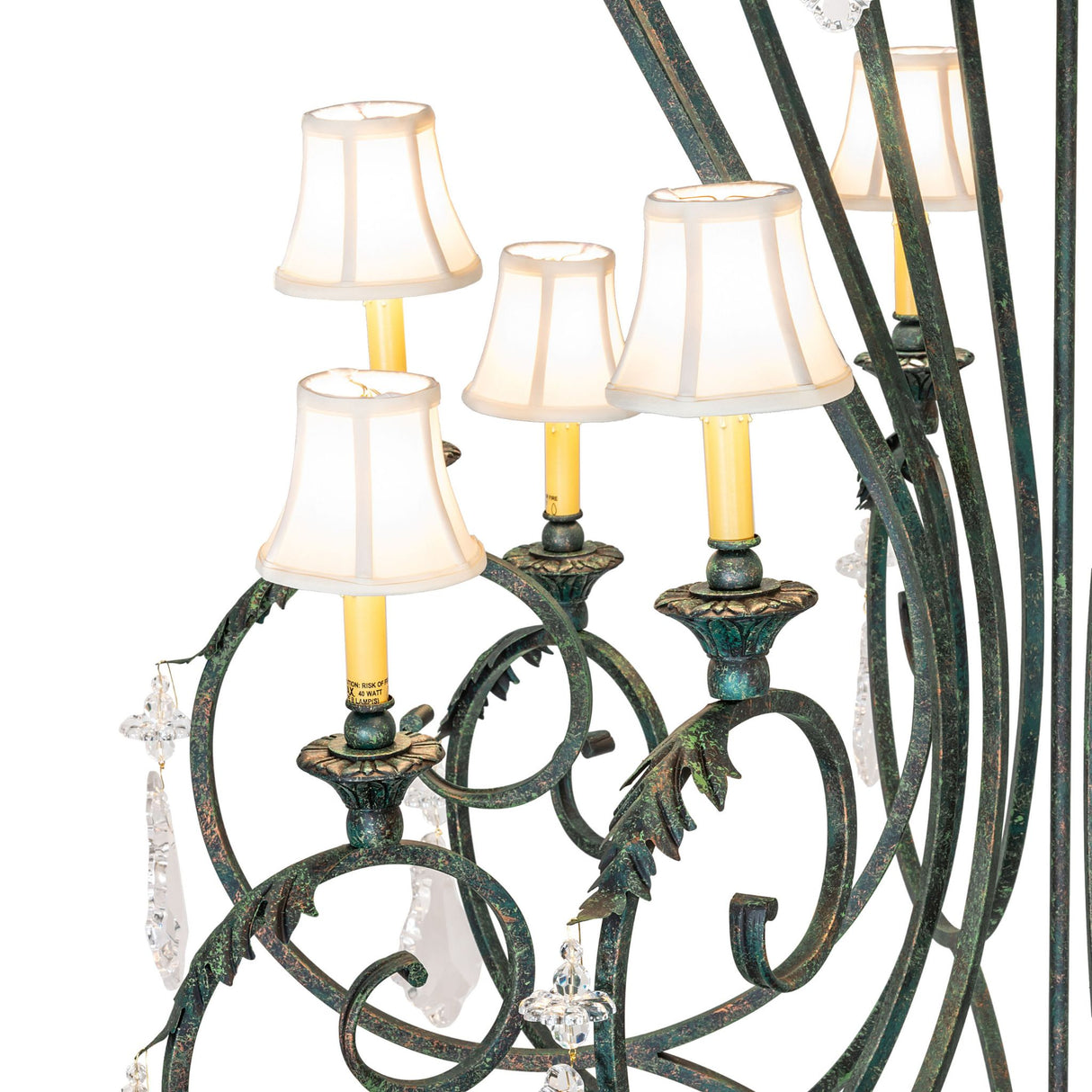 Close-up of Josephine chandelier arm with fabric shade and candlelight socket.