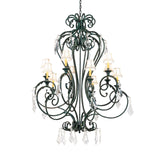 Lit view of 10-light chandelier with Golden Verde finish and crystal accents.