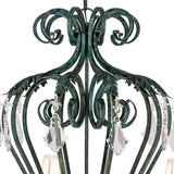 Close up of upper scrollwork and crystal pendalogues detail on chandelier.