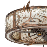 Closeup of intricate floral metalwork and mica panel texture.