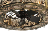 Close-up of bronze fan beneath floral shade detailing.