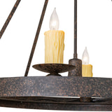 Close-up detail of candle-style light, textured coffee bean finish, and metal plate.
