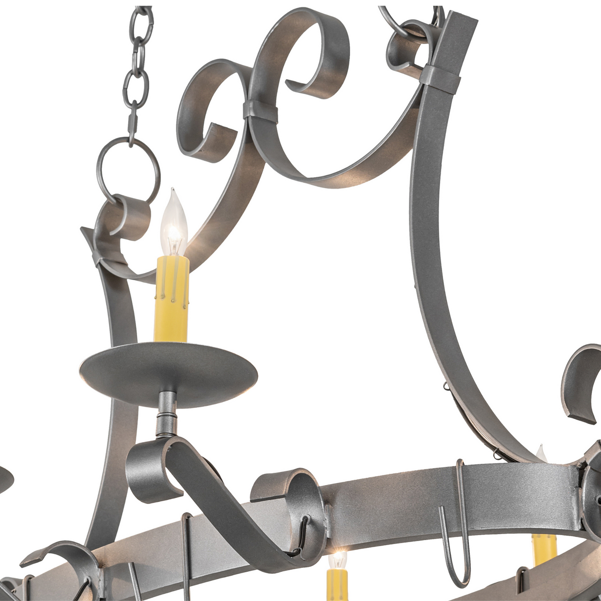 Closeup detail of hand-forged scrollwork on chandelier.