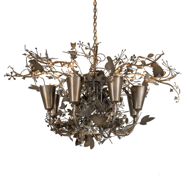 Lau Lau 8 light chandelier lit view with warm glow.