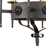 Detail view of Lorenzo chandelier floral medallion accent on circular metal band.