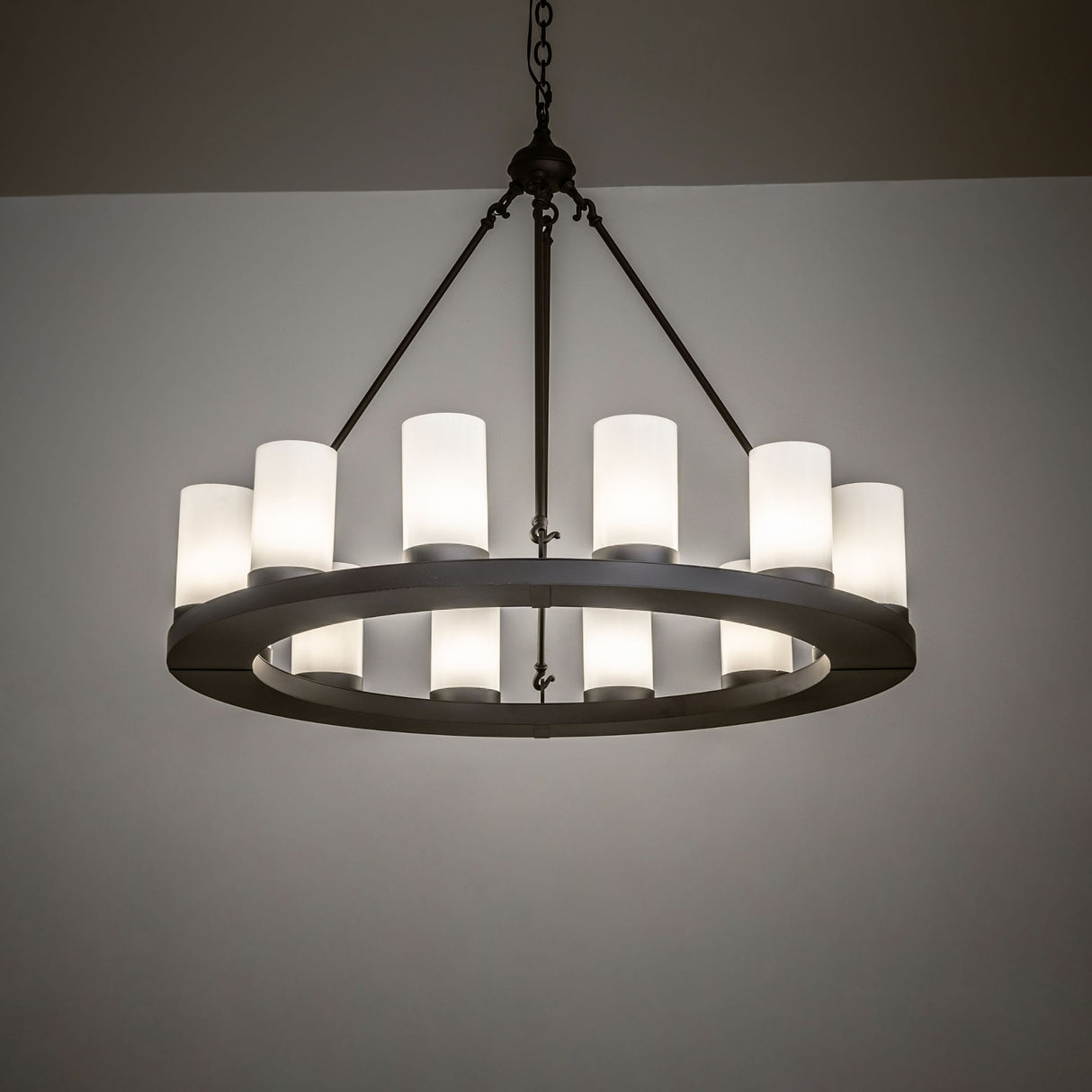 Ambient room view of the Loxley 12-light chandelier casting warm, even illumination.