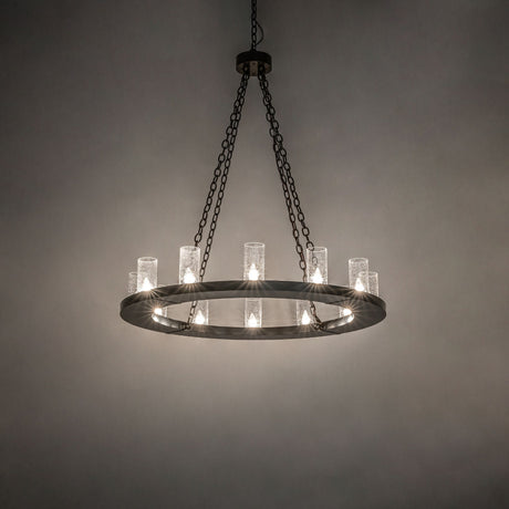 Loxley 12-light bronze chandelier glowing in inside room setting.