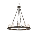 Lit view of Loxley 12-light chandelier with seeded glass and bronze ring.