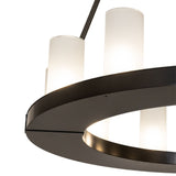 Close up of the chandelier showing the circular ring and frosted glass cylinder shades.