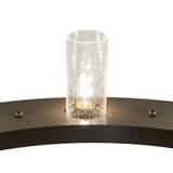 Close-up of lit glass shade on Loxley chandelier ring.