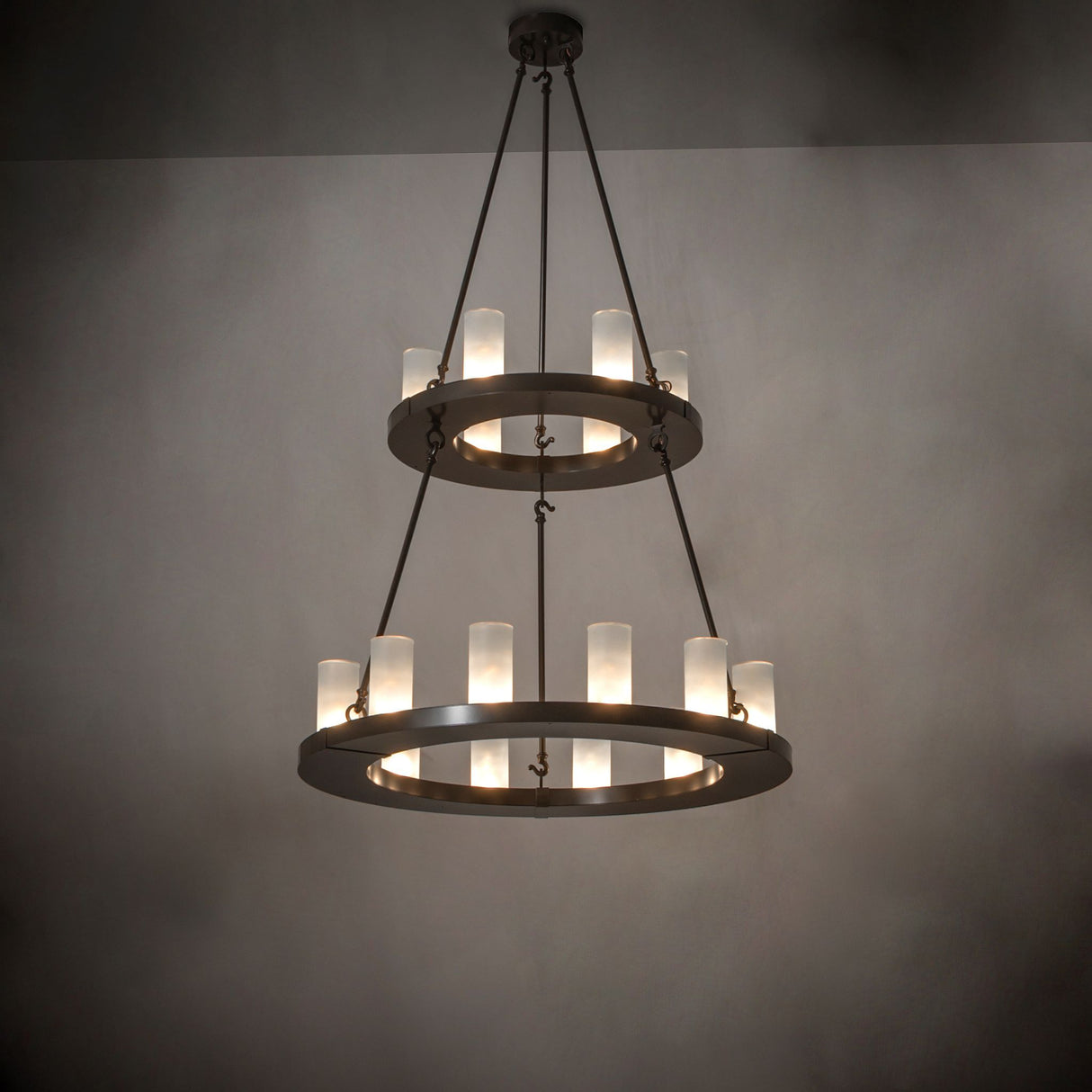 Loxley two tier chandelier installed in an interior showing warm ambient lighting.
